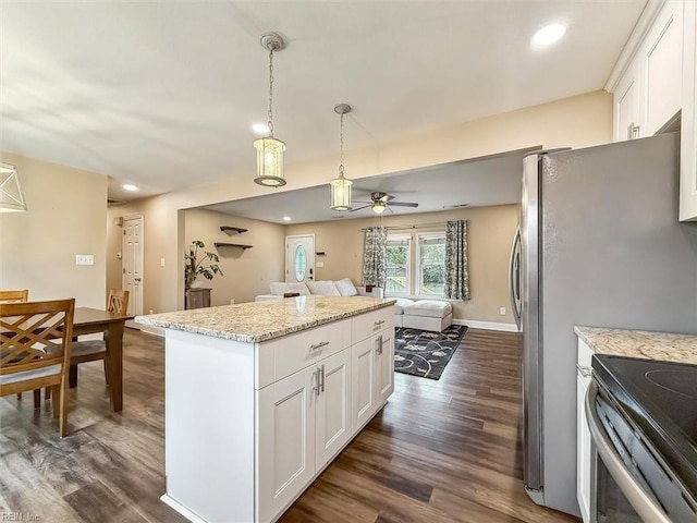 kitchen featuring dark wood-type flooring, a center island, and white cabinets