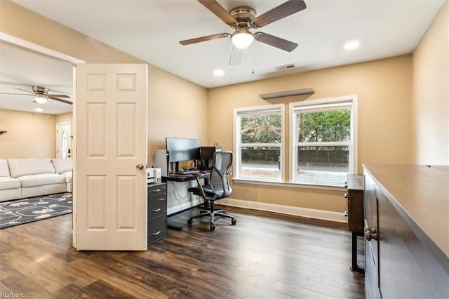 office space with dark wood-style floors, recessed lighting, visible vents, and baseboards