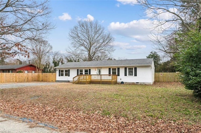 ranch-style home featuring a deck, a front lawn, and fence