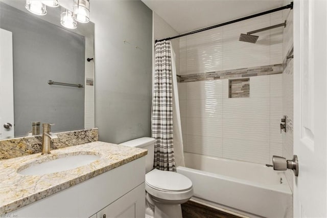 bathroom with vanity, shower / bath combination with curtain, and toilet