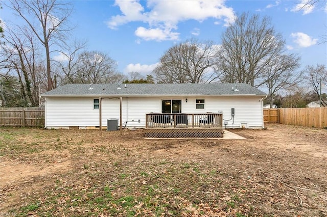 rear view of house featuring crawl space, a fenced backyard, central AC, and a wooden deck