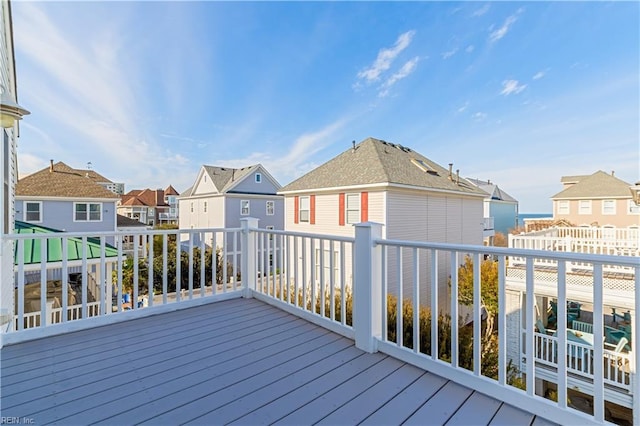 wooden terrace with a residential view