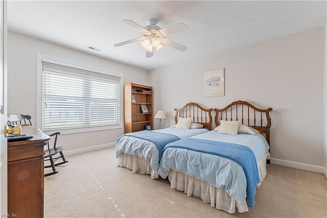 bedroom featuring carpet flooring, ceiling fan, visible vents, and baseboards