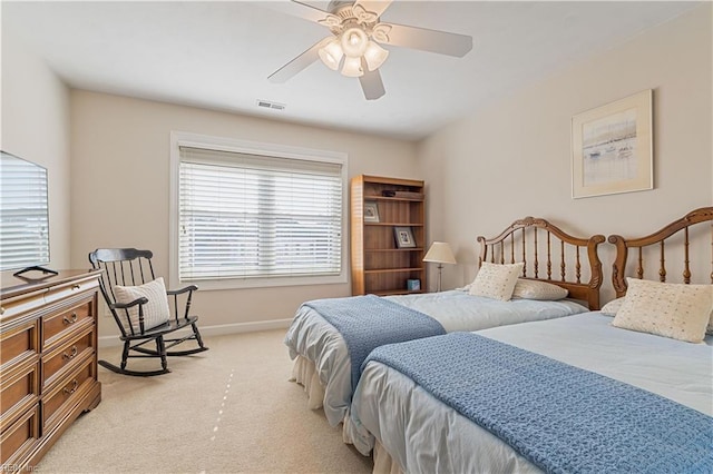 bedroom with visible vents, ceiling fan, light carpet, and baseboards