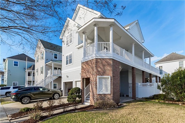 view of front facade with concrete driveway and brick siding