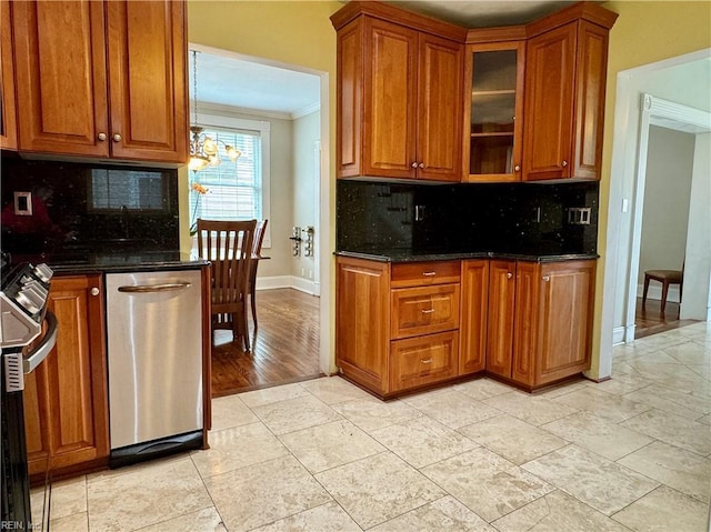 kitchen featuring dark stone counters, stainless steel dishwasher, brown cabinetry, and crown molding