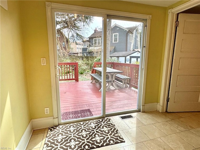 entryway featuring visible vents, baseboards, and light tile patterned flooring