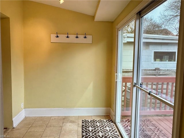 entryway featuring light tile patterned floors and baseboards