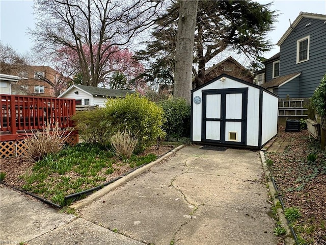 view of shed with fence