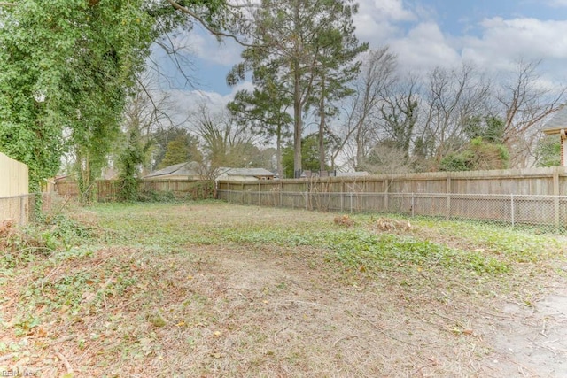 view of yard with a fenced backyard