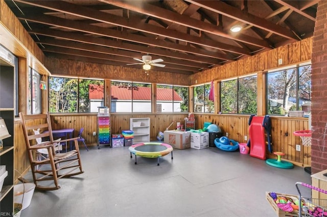 sunroom with plenty of natural light and ceiling fan