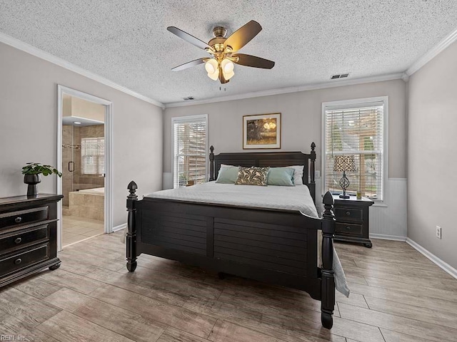 bedroom featuring ornamental molding, visible vents, and light wood finished floors