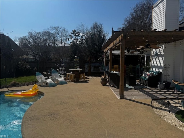 view of patio / terrace with an outdoor pool, ceiling fan, and a pergola