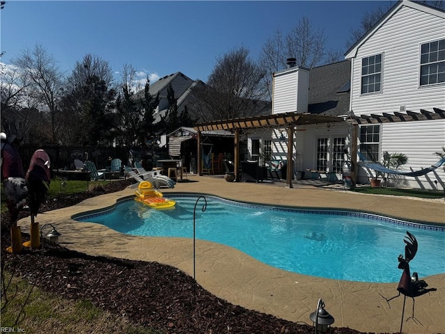 outdoor pool featuring a patio area and a pergola