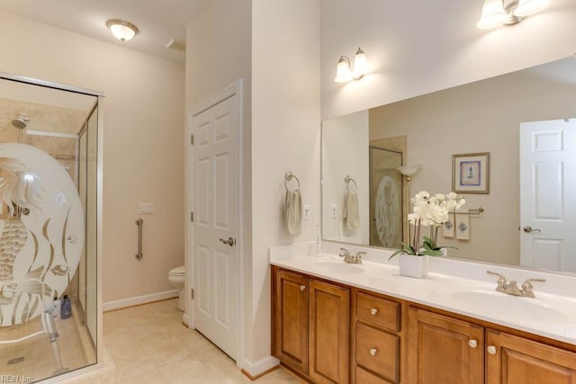 full bath with a stall shower, a sink, toilet, and double vanity