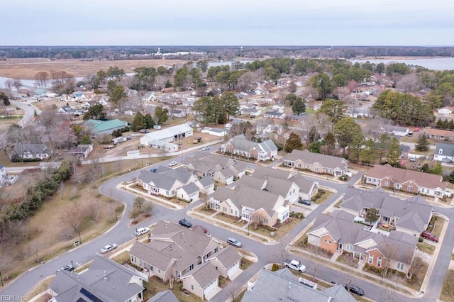 drone / aerial view with a water view and a residential view