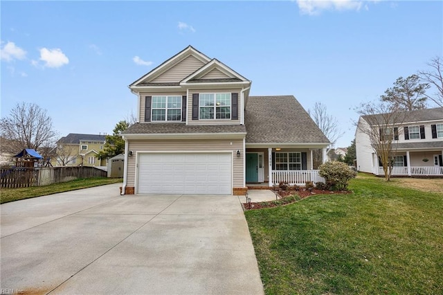 view of front of home with driveway, a garage, covered porch, fence, and a front yard