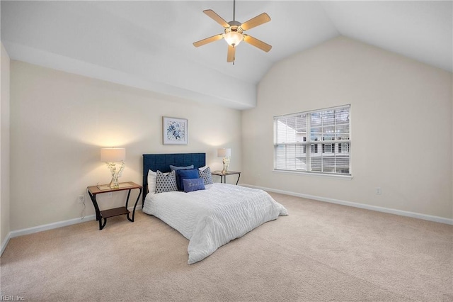 carpeted bedroom with lofted ceiling, ceiling fan, and baseboards