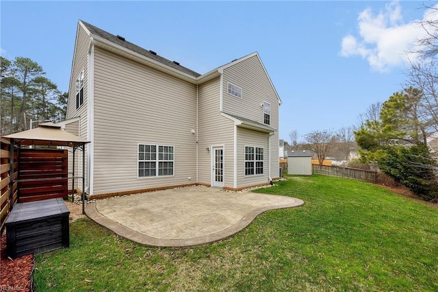 back of house with a patio area, a yard, a gazebo, and fence