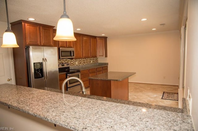 kitchen featuring stone countertops, stainless steel appliances, a center island, brown cabinets, and decorative backsplash