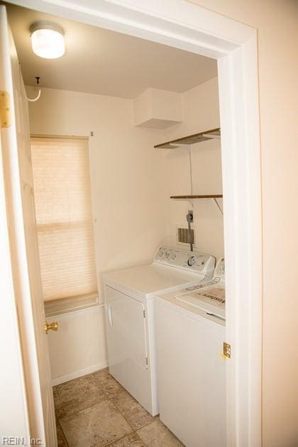 laundry area with laundry area and washing machine and clothes dryer