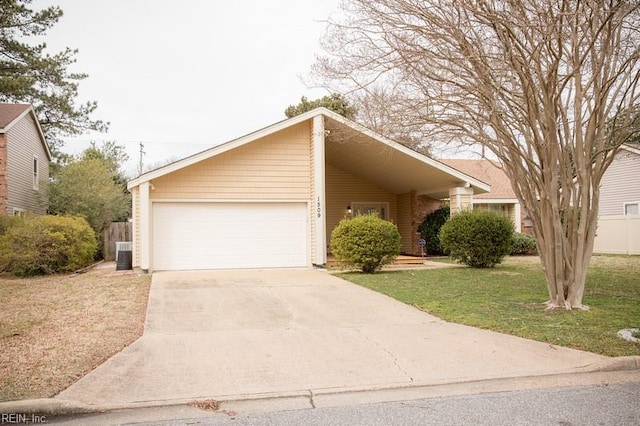 view of front of property featuring driveway, an attached garage, fence, central AC, and a front yard