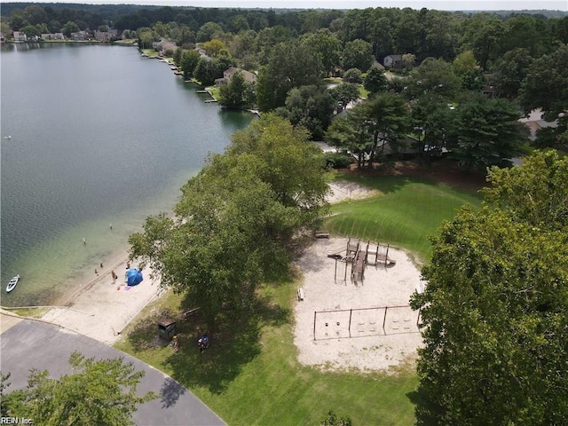 bird's eye view with a water view and a view of trees