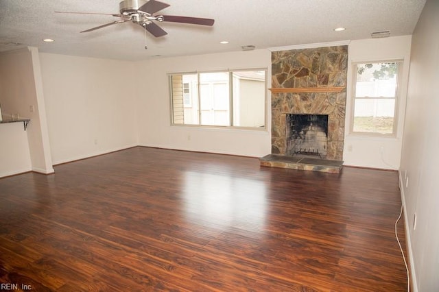 unfurnished living room with ceiling fan, a fireplace, wood finished floors, and recessed lighting