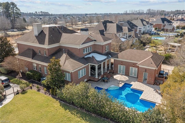 birds eye view of property with a residential view