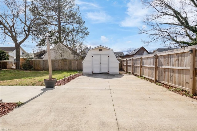 exterior space featuring a storage shed, an outdoor structure, and a fenced backyard