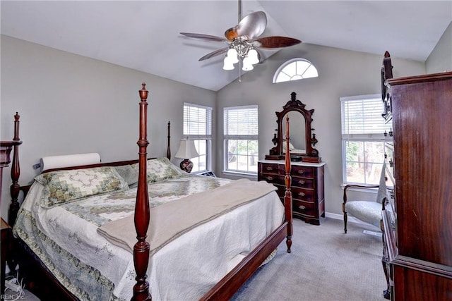 bedroom featuring baseboards, vaulted ceiling, a ceiling fan, and light colored carpet