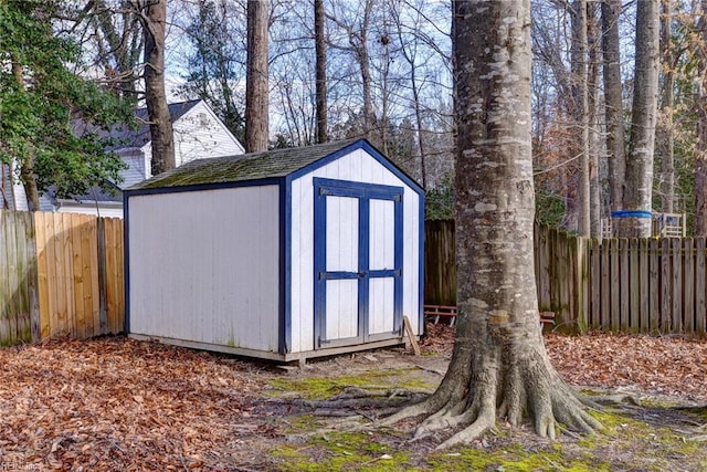 view of shed featuring a fenced backyard