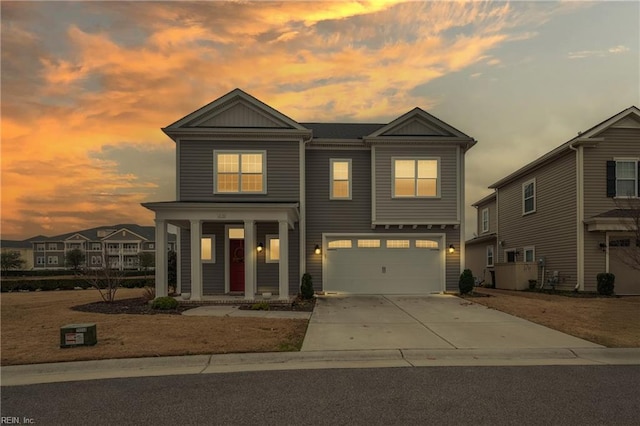 view of front of property featuring driveway and an attached garage