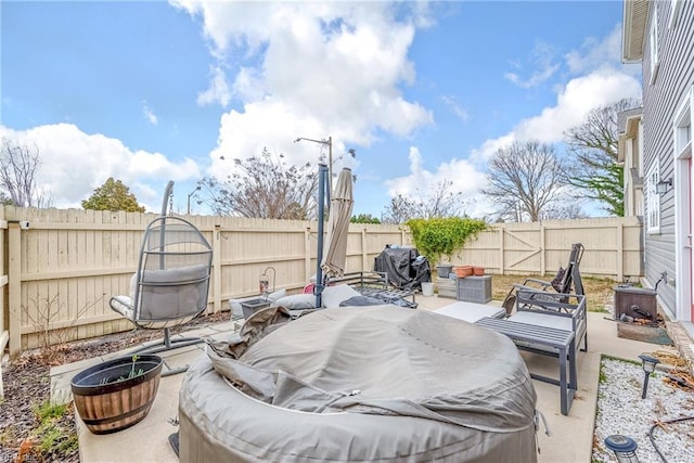 view of patio / terrace featuring outdoor lounge area, a fenced backyard, and a grill