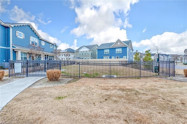 view of community with fence and a residential view