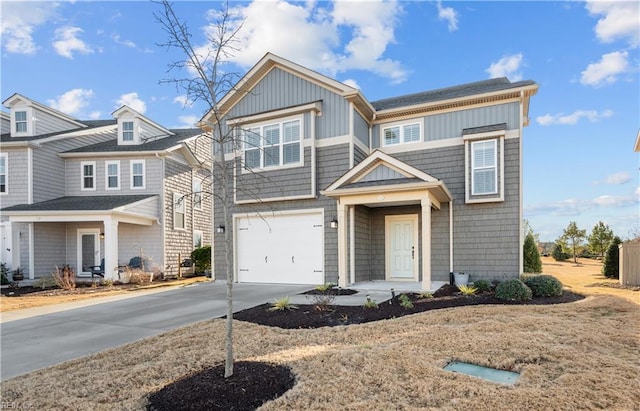 view of front facade with concrete driveway and an attached garage