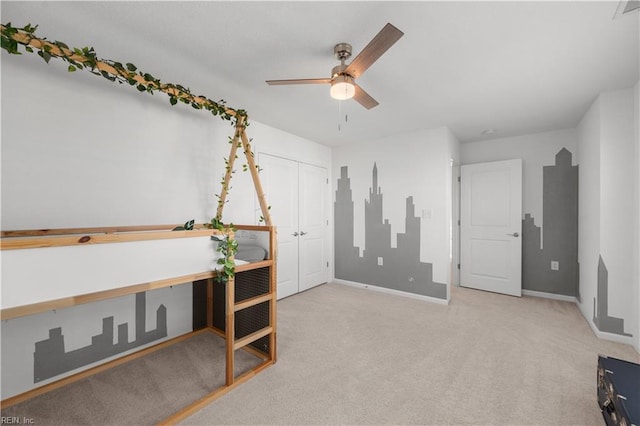 carpeted bedroom with ceiling fan, a closet, visible vents, and baseboards