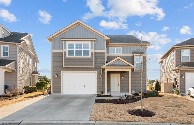 view of front of house featuring a garage, board and batten siding, and concrete driveway