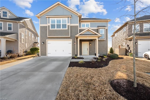 view of front of house with concrete driveway and an attached garage