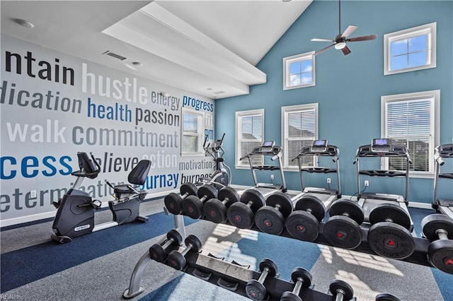 gym featuring high vaulted ceiling, ceiling fan, and baseboards