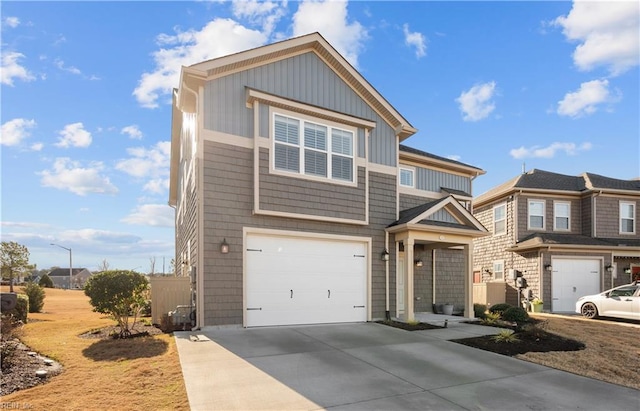 view of front of property with concrete driveway and an attached garage