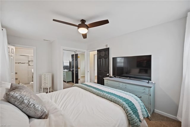 bedroom featuring visible vents, baseboards, connected bathroom, ceiling fan, and carpet floors