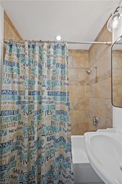 full bathroom featuring a sink and shower / tub combo with curtain