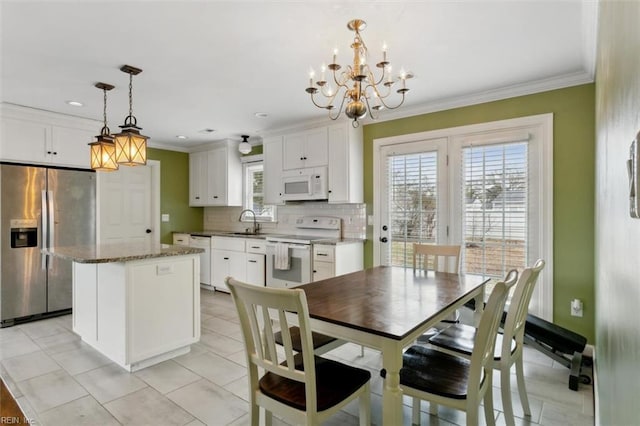 dining room featuring recessed lighting, light tile patterned flooring, crown molding, and a notable chandelier