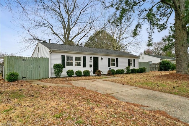 single story home featuring fence