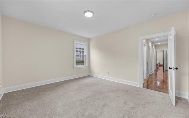 unfurnished room with carpet floors, recessed lighting, and baseboards