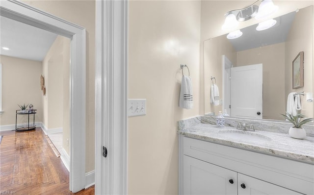 bathroom with vanity and baseboards