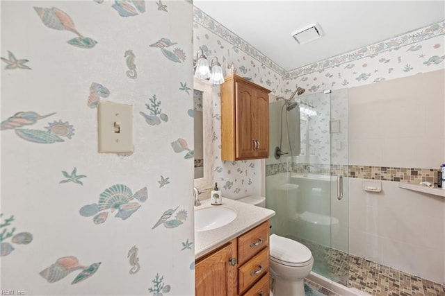 bathroom with toilet, a stall shower, visible vents, and wallpapered walls