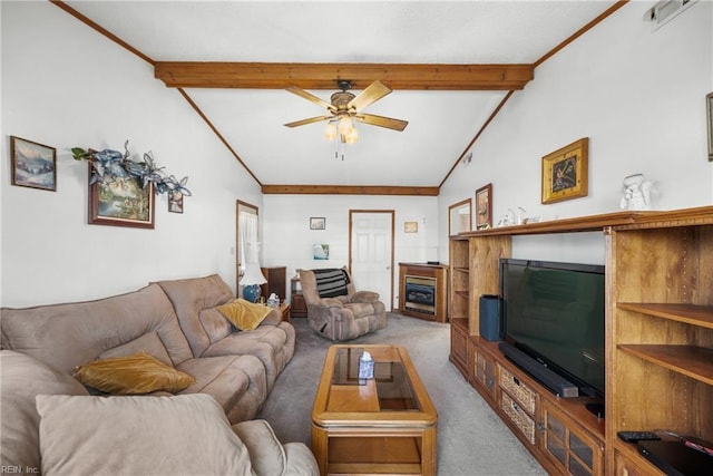 living area with vaulted ceiling with beams, ceiling fan, a fireplace, carpet flooring, and ornamental molding