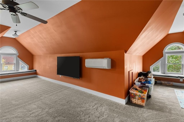 additional living space with baseboards, ceiling fan, a wall mounted air conditioner, vaulted ceiling, and carpet floors